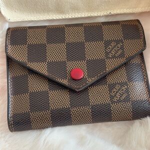 Louis Vuitton Brown Checkered Wallet with Red Button.